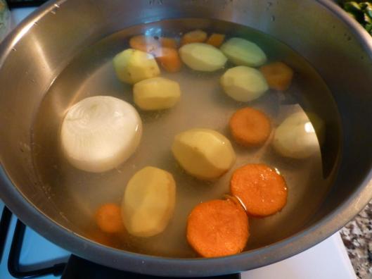 Peel the onion, potatoes and carrots then cut them small pieces and add in the cooking pan with lemon juice.